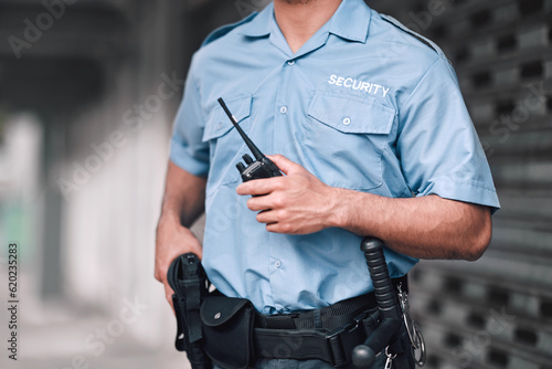 Cuadro en lienzo Security guard, safety officer and man with walkie talkie in hand on street for protection, patrol or watch