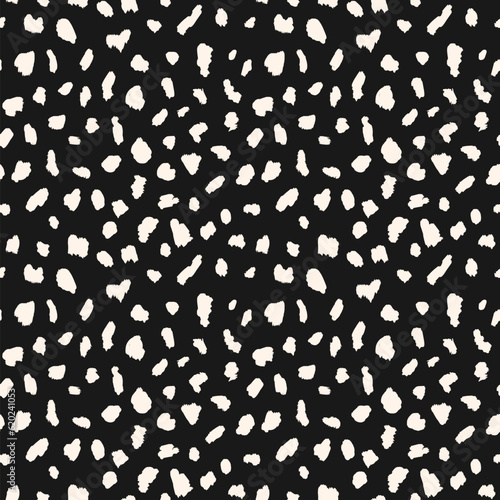Abstract animal skin vector seamless pattern. Simple black and white texture with irregular brush spots, dots, strokes. Cute monochrome background. Wild leopard print. Minimal repeat geo design