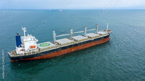 Self-unloading bulk carrier at Rio De La Plata anchorage. Aerial side view.