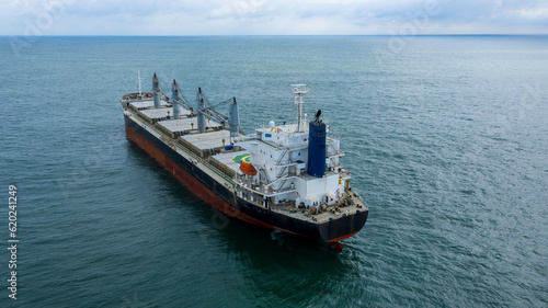 Self-unloading bulk carrier at Rio De La Plata anchorage. Aerial stern view.