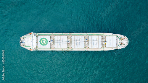 Self-unloading bulk carrier at Rio De La Plata anchorage. Aerial top down view.