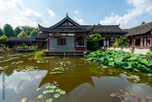 Chinese ancient architecture, garden scenery, and ponds full of lotus flowers