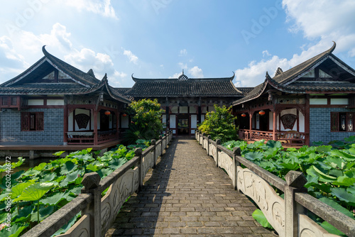 Chinese ancient architecture, garden scenery, and ponds full of lotus flowers