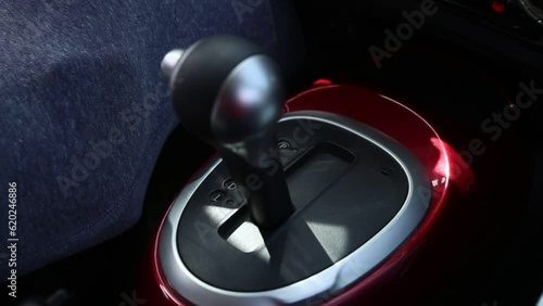 man's hand shifting gears automatic transmission car 