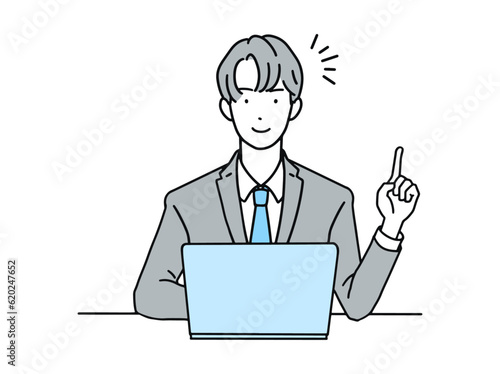 PCを操作しながら指差しポーズをするビジネスパーソン(会社員)男性