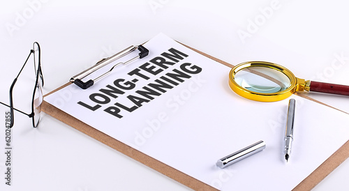 Wallpaper Mural LONG TERM PLANNING text on clipboard on white background, business concept Torontodigital.ca