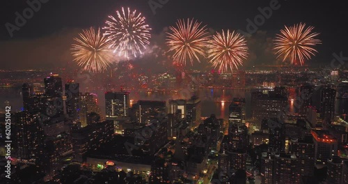 Awesome Aerial Video of NYC's 4th of July Fireworks Light up the Night sky over tall dark buildings Manhattan Queens Brooklyn