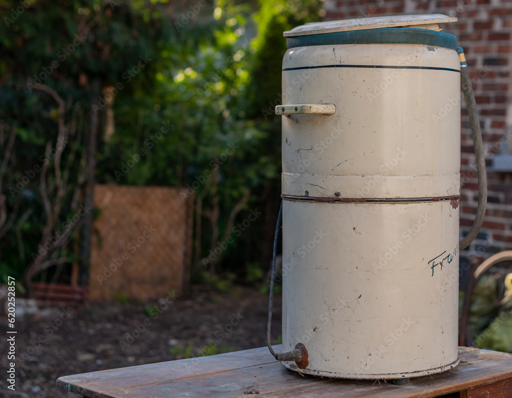 Obraz premium Reviving the Time-Honored Splendor of an Antique Washing Machine