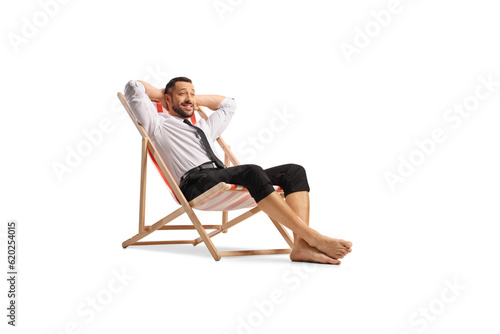 Businessman sitting on a beach chair and relaxing