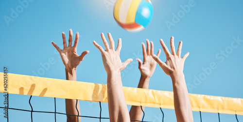 Volleyball, hands and net with sports and fitness, people outdoor playing game with blue sky and summer. Exercise, athlete and group, match with ball and active, workout and team with tournament