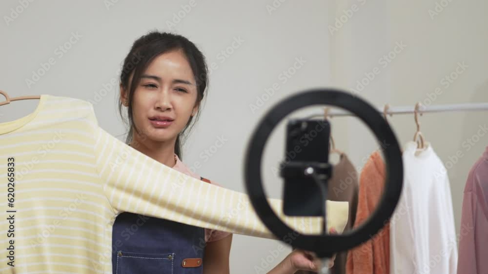 Female asian live streaming online for sale a clothes, e-commerce and marketing media.. Female asian live streaming online for sale a clothes, e-commerce and marketing media..