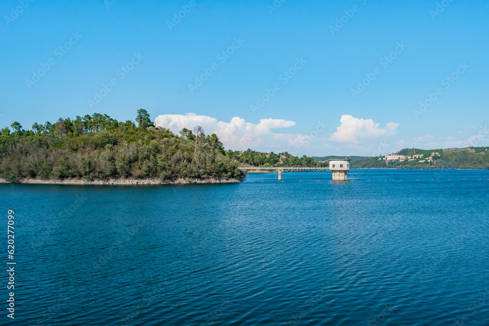 Water from the river Zêzere at the Castelo do Bode dam with banks on the horizon, Tomar PORTUGAL
