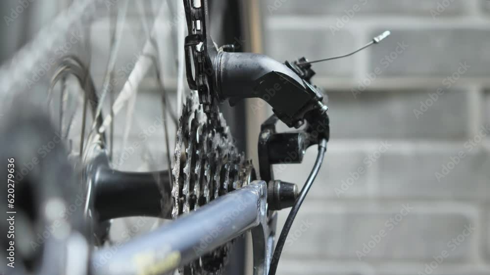 Closeup of a spinning bicycle wheel in the The cassette does