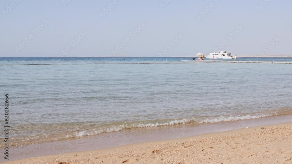 Sea water wave come to beach. Landscapes view of beach sea sand and sky in summer day. Beach sea space area on the tropical island. Advertising, background picture. Summer background. High quality 4k Sea water wave come to beach. Landscapes view of beach sea sand and sky in summer day. Beach sea space area on the tropical island. Advertising, background picture. Summer background. High quality 4k