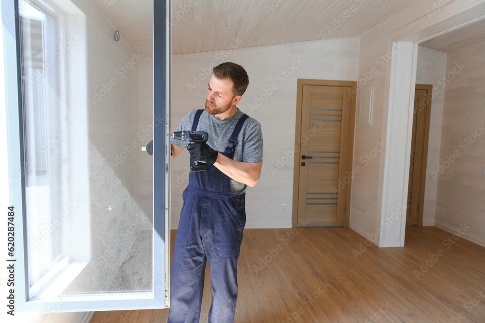 Process of construction new and modern modular house from composite sip panels. Worker man in special protective uniform wear working on building development industry of energy efficient property. Process of construction new and modern modular house from composite sip panels. Worker man in special protective uniform wear working on building development industry of energy efficient property.