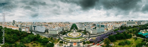 Aerial drone panoramic view of Parque Eduardo XII and Marques the Pombal looking south with Avenida da Liberdade in Lisbon, Portugal photo