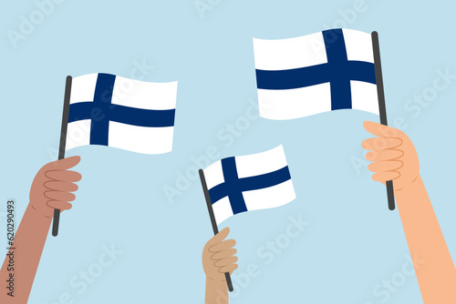 Diverse hands raising flags of Finland. Vector illustration of Finnish flags in flat style on blue background.