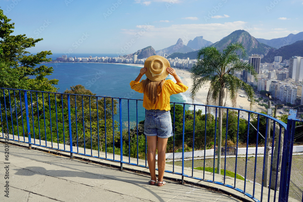 © zigres - Holidays in Brazil. Full length view of tourist girl looking at Rio de Janeiro cityscape with Copacabana beach, Rio de Janeiro, Brazil. © zigres - Holidays in Brazil. Full length view of tourist girl looking at Rio de Janeiro cityscape with Copacabana beach, Rio de Janeiro, Brazil.