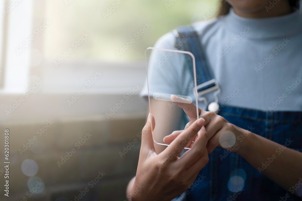 The girl is using virtual screen laptop, Searching for internet for educational information.