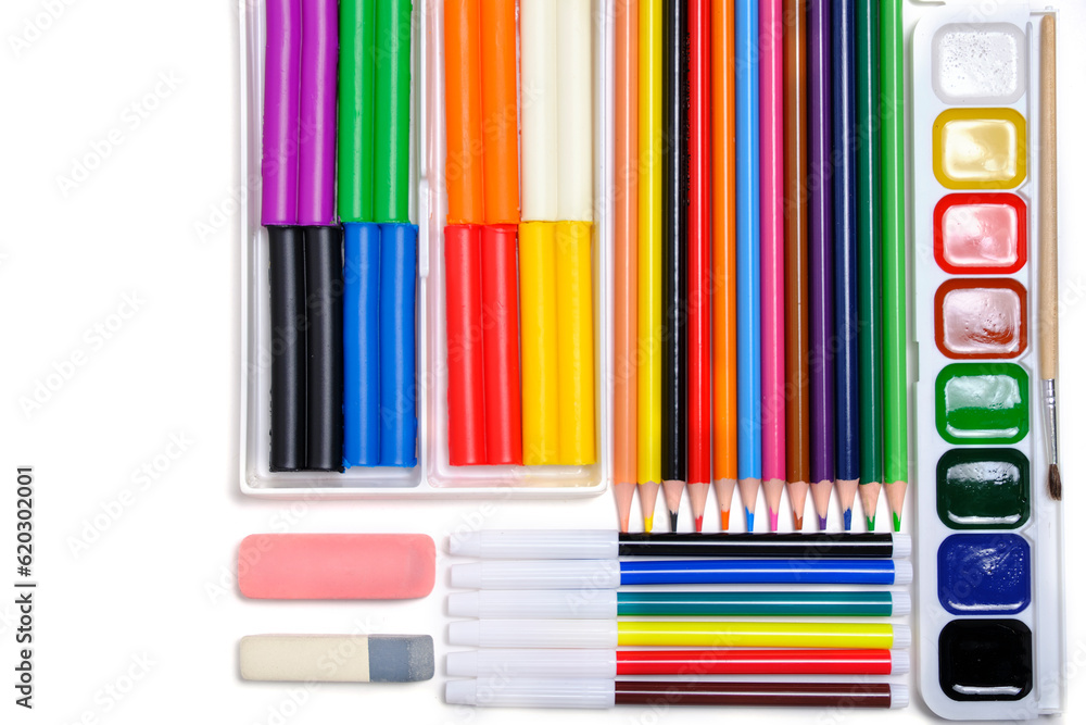 Obraz premium Children, school set for creativity and drawing from colored pencils, watercolor paints, felt tip pens and plasticine.