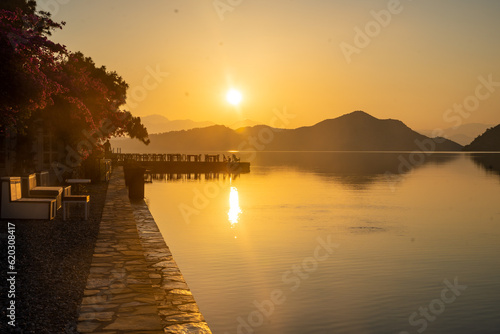 Fototapeta Naklejka Na Ścianę i Meble -  Beautiful sea coast and Adaian restaurant near Cleopatra Bath Bay, Gocek, Fethie, Turkey in the morning
