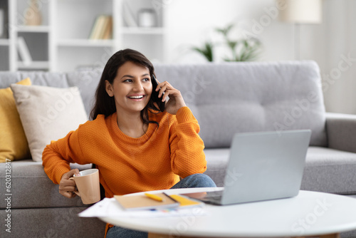 Positive pretty eastern woman independent contractor working from home