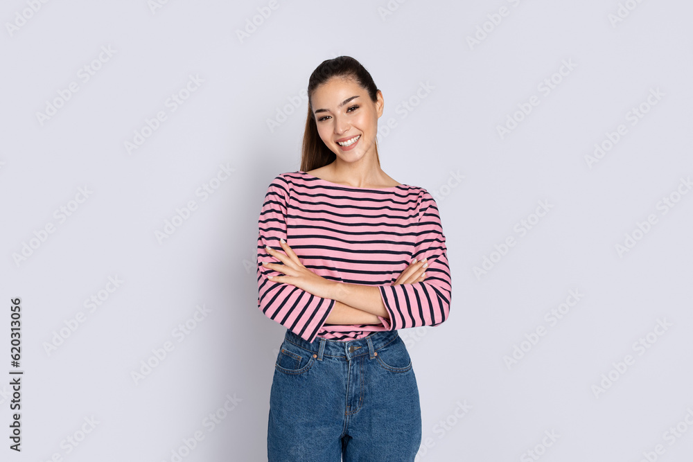 Beautiful young hispanic woman posing on grey studio background Beautiful young hispanic woman posing on grey studio background