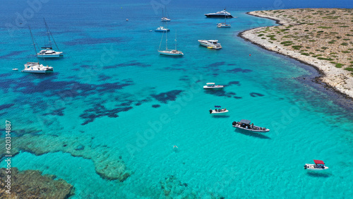 Aerial drone photo of azure paradise blue lagoon of Panteronisi a small islet complex between Paros and Antiparos islands, Cyclades, Greece