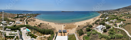 Aerial drone photo of famous for surfers sandy beach of Chrysi Akti or Golden beach with crystal clear emerald sea calm with no wind, Paros island, Cyclades, Greece