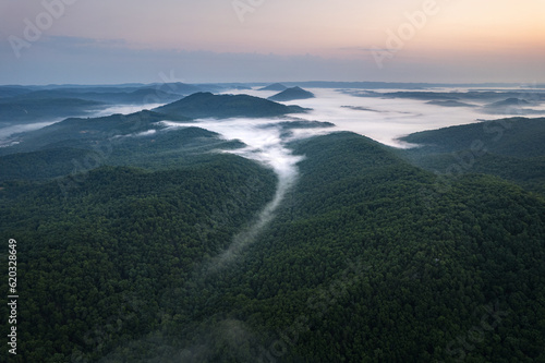 Cumberland Gap through Cumberland Mountains, within Appalachian Mountains. Tripoint of Kentucky, Virginia, and Tennessee. Pinnacle Overlook at key passageway. Foggy sunrise