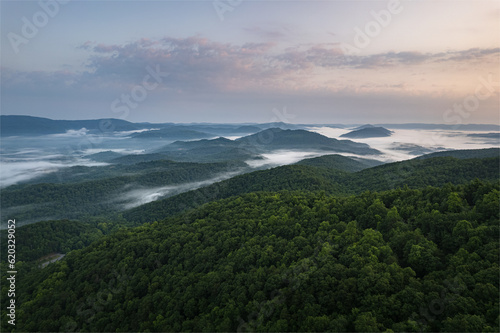 Cumberland Gap through Cumberland Mountains, within Appalachian Mountains. Tripoint of Kentucky, Virginia, and Tennessee. Pinnacle Overlook at key passageway. Foggy sunrise
