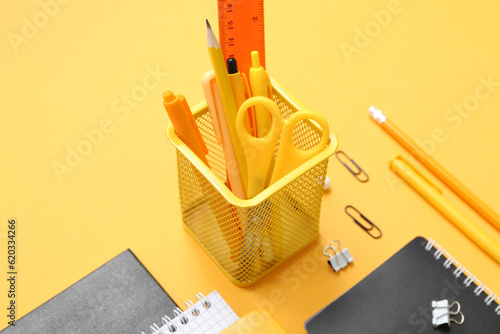 Yellow desk organizer with ...