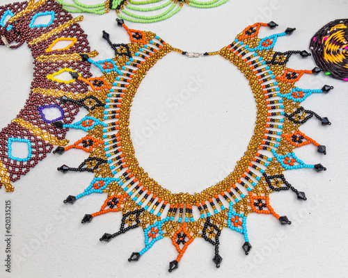 Necklace of beads made by Quechua (Kichwa) women from ecuadorian Amazon region at the artisan's market. Pastaza province, Ecuador