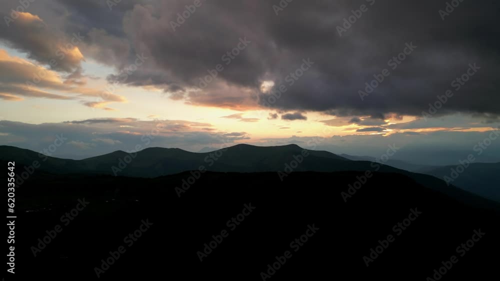 Fantastic mountain peaks glow at sunset. Red rocks at sunset. Aerial view. Mountains Komovi. Montenegro. Fantastic mountain peaks glow at sunset. Red rocks at sunset. Aerial view. Mountains Komovi. Montenegro.