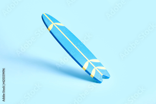 Mini color surfboard on blu...