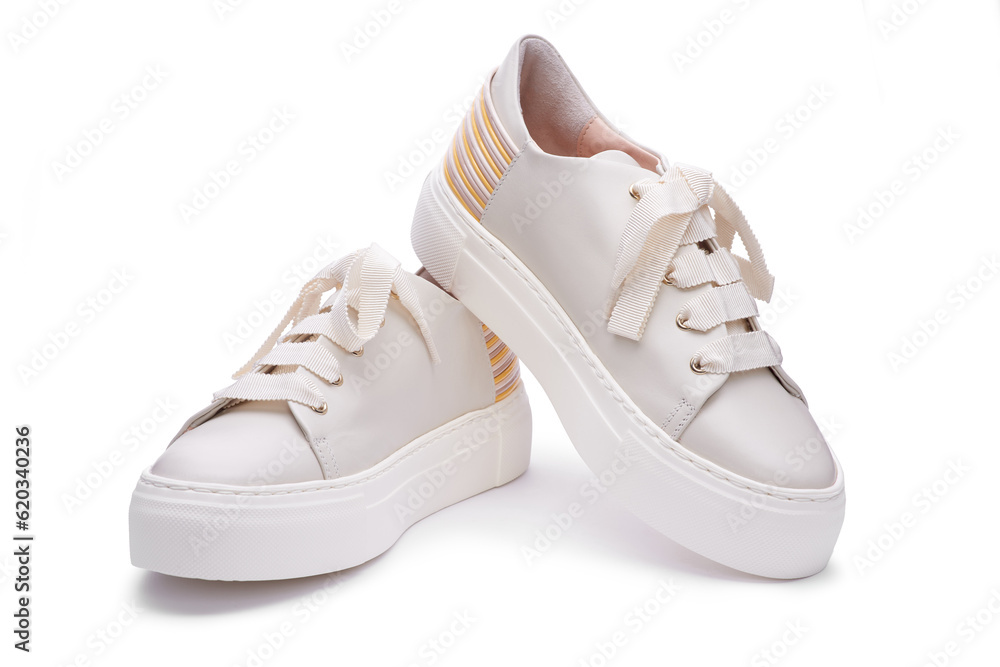 Stylish modern pastel sneakers with thick white rubber platform sole, multicolor detail on the back. Isolated on the white background, close up view.  Shoe sell mock-up
