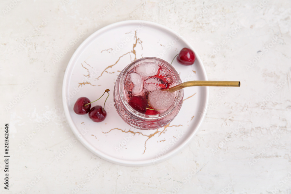 Glass of tasty cherry lemonade on white background Glass of tasty cherry lemonade on white background