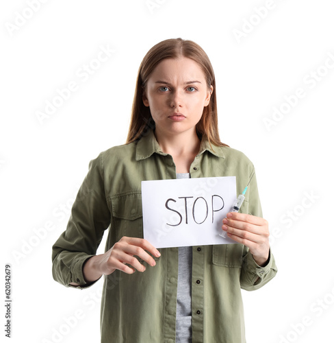 Young female junkie holding...