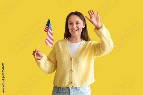 Happy young woman with USA ...