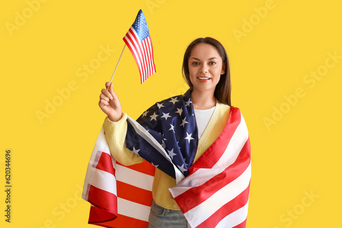 Happy young woman with USA ...