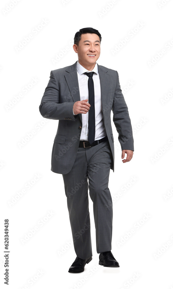 Businessman in suit walking on white background Businessman in suit walking on white background