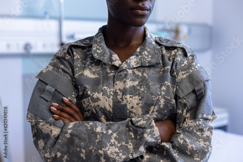 African american woman female soldier military uniform crossing arms at hospital photo