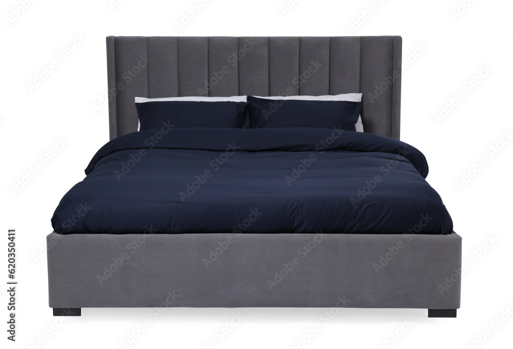Comfortable gray bed with dark blue linens on white background Comfortable gray bed with dark blue linens on white background