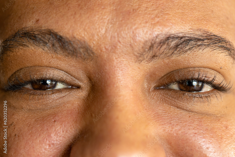 Close up of eyes of biracial casual businessman smiling Close up of eyes of biracial casual businessman smiling