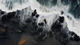 water lapping rocks, black sand, rough sea