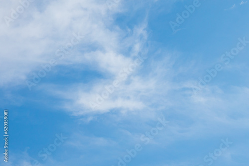 Clouds in the blue sky. Summer blue sky cloud gradient light white background. Beauty clear cloudy in sunshine calm bright winter air bacground. Image of beautiful blue sky.