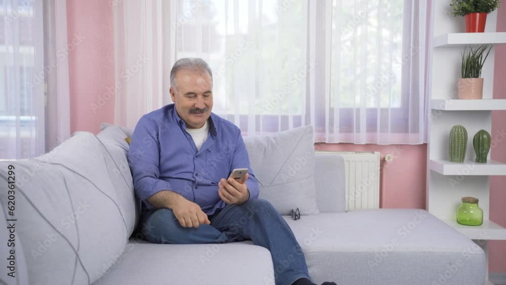 Disappointed old man texting. Disappointed old man texting.