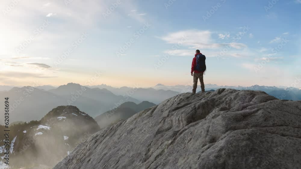 Adventurous Man Standing on top of Mountain Cliff. Extreme Adventure Composite. 3d Rendering Peak. Background Aerial Image from BC, Canada.