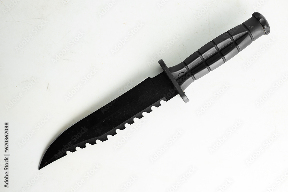 Black knife. Hunting knife on a white background. Combat army knife made of high- quality stainless steel. Marine corps knife. Black knife. Hunting knife on a white background. Combat army knife made of high- quality stainless steel. Marine corps knife.