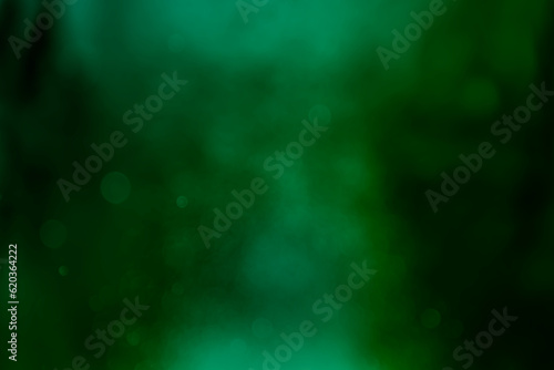 Abstract green light gradient on blurred bokeh glitter background. Idea for wallpaper, website, template, christmas theme etc., 
